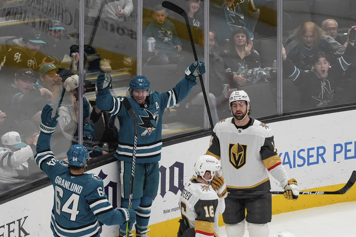 San Jose Sharks center Tyler Toffoli, second from left, reacts after scoring a goal against the ...