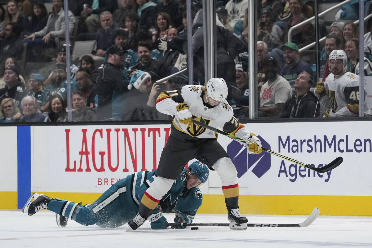 San Jose Sharks defenseman Shakir Mukhamadullin, bottom, and Vegas Golden Knights center Willia ...