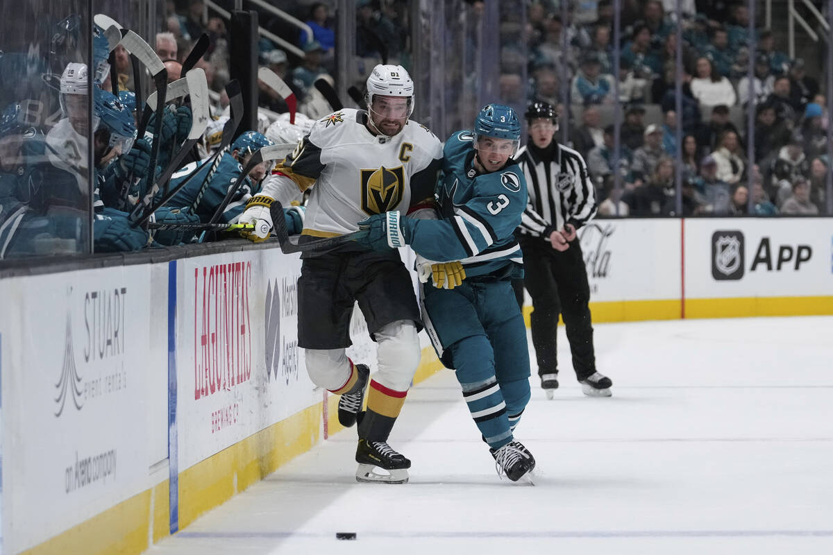 Vegas Golden Knights right wing Mark Stone (61) and San Jose Sharks defenseman Henry Thrun (3) ...