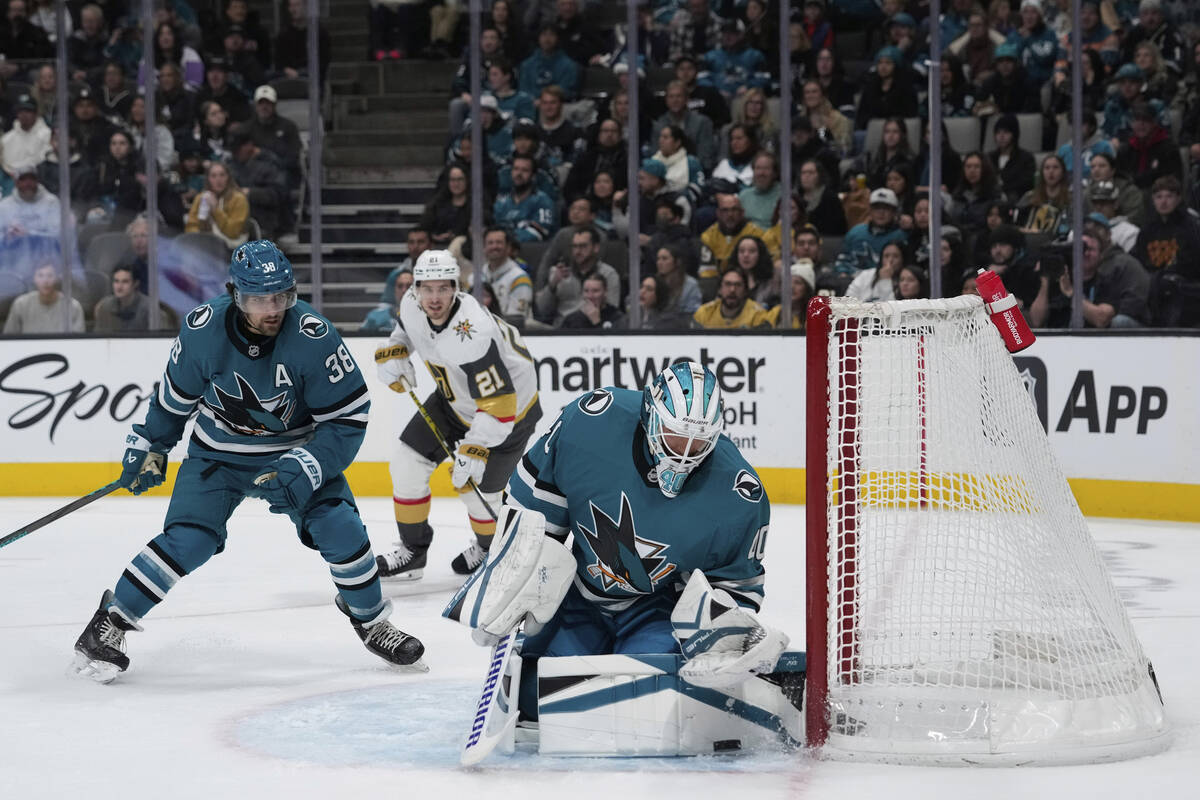 San Jose Sharks goaltender Alexandar Georgiev, right, stops a shot by the Vegas Golden Knights ...