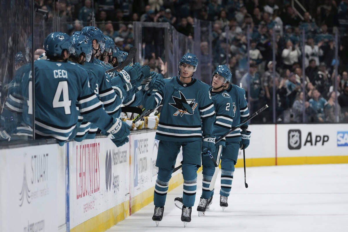 San Jose Sharks defenseman Shakir Mukhamadullin, third from right, celebrates with teammates af ...