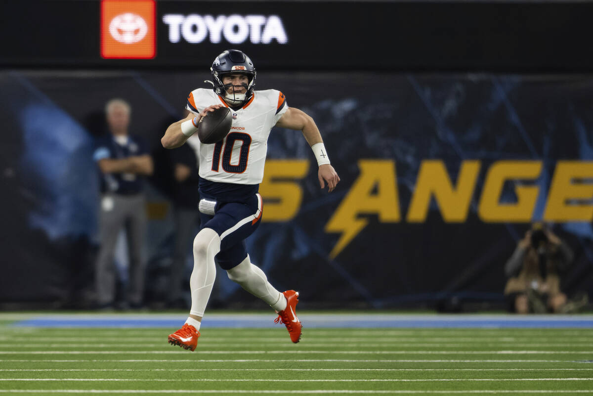 Denver Broncos quarterback Bo Nix (10) runs with the ball during an NFL football game against t ...