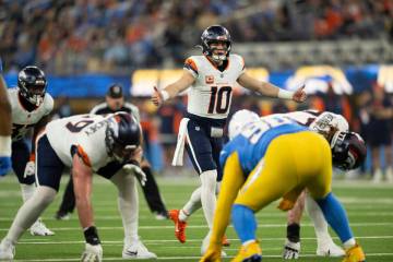 Denver Broncos quarterback Bo Nix (10) gestures during an NFL football game against the Los Ang ...