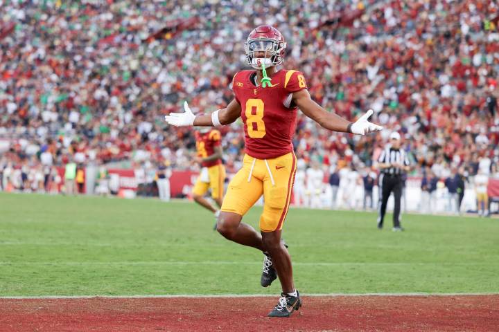 Southern California wide receiver Ja'Kobi Lane reacts after scoring a touchdown during the seco ...