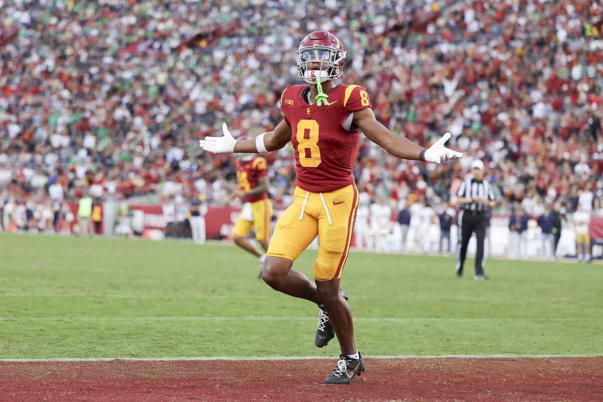 Southern California wide receiver Ja'Kobi Lane reacts after scoring a touchdown during the seco ...