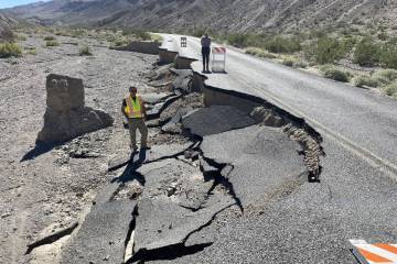 Federal Highway Administration engineers inspect the damage to Emigrant Canyon Road after Tropi ...