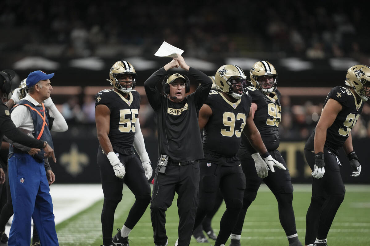 New Orleans Saints interim head coach Darren Rizzi calls out from the sideline in the second ha ...