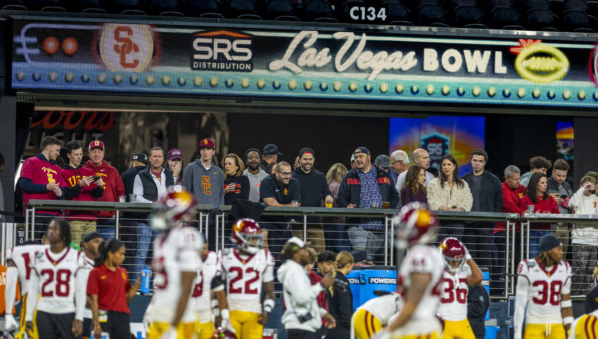 USC Trojans fans watch players as they warm up to face the Texas A&M Aggies for their Las V ...