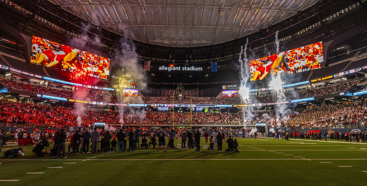 Fireworks erupt as the teams are announced for the first half of their Las Vegas Bowl game at A ...