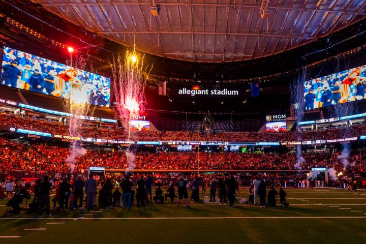 Fireworks erupt as the teams are announced for the first half of their Las Vegas Bowl game at A ...