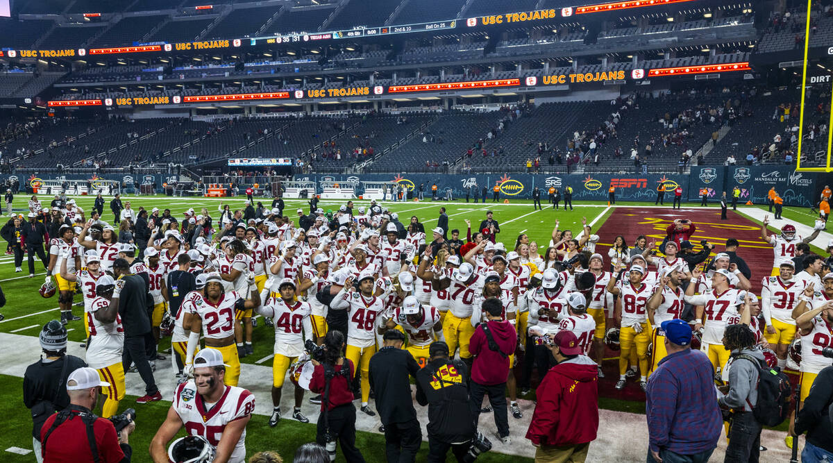 USC Trojans players celebrate their 35-31 win over the Texas A&M Aggies following the secon ...