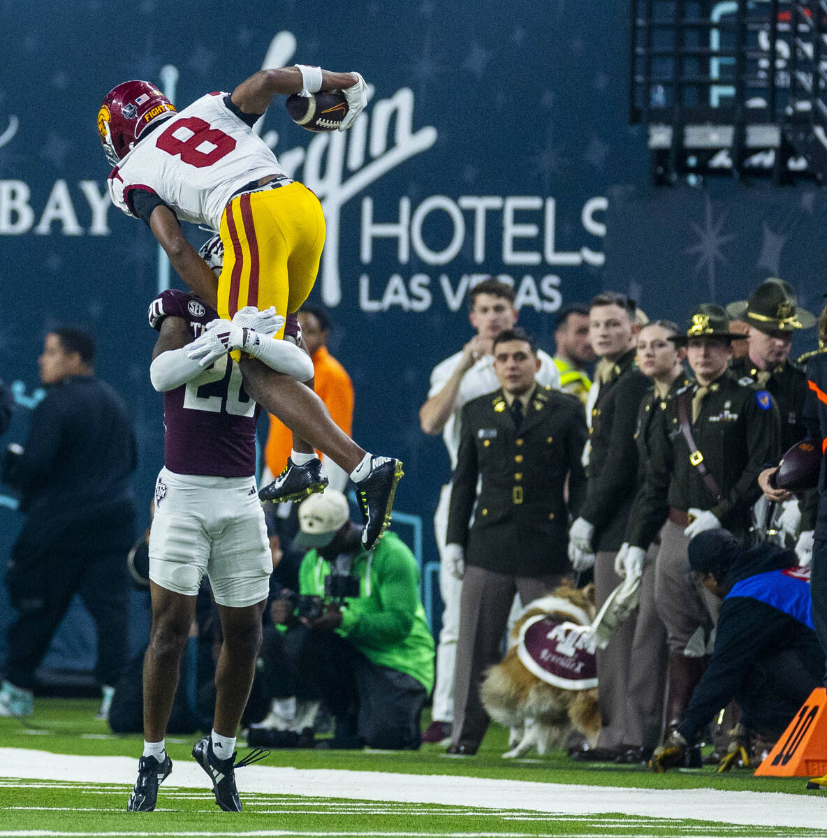 USC Trojans wide receiver Ja'Kobi Lane (8) attempts to go over Texas A&M Aggies defensive b ...