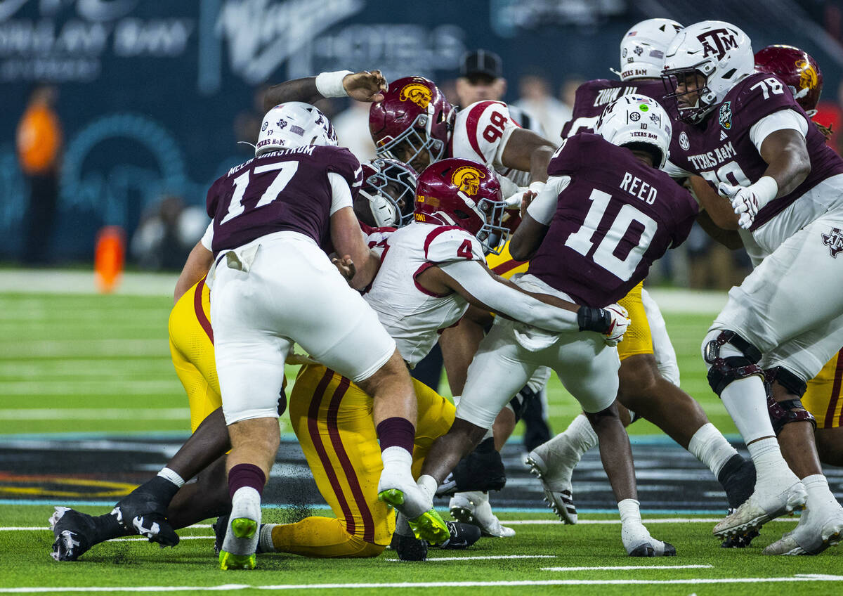 Texas A&M Aggies quarterback Marcel Reed (10) is sacked by USC Trojans linebacker Easton Ma ...