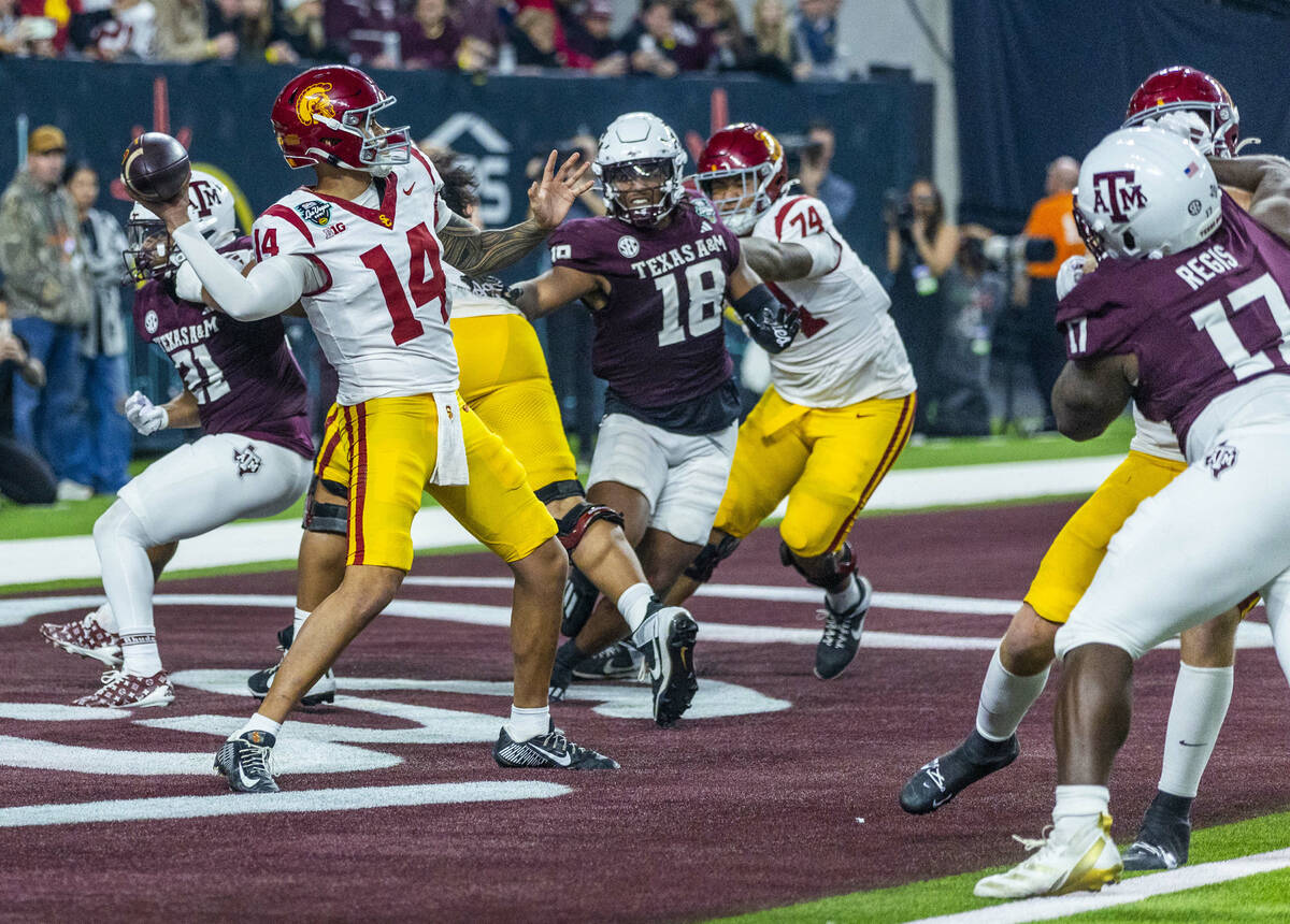 USC Trojans quarterback Jayden Maiava (14) gets off a pass from the end zone as Texas A&M A ...