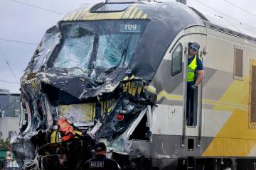 A damaged Brightline train is seen after it collided with a fire truck in downtown Delray Beach ...