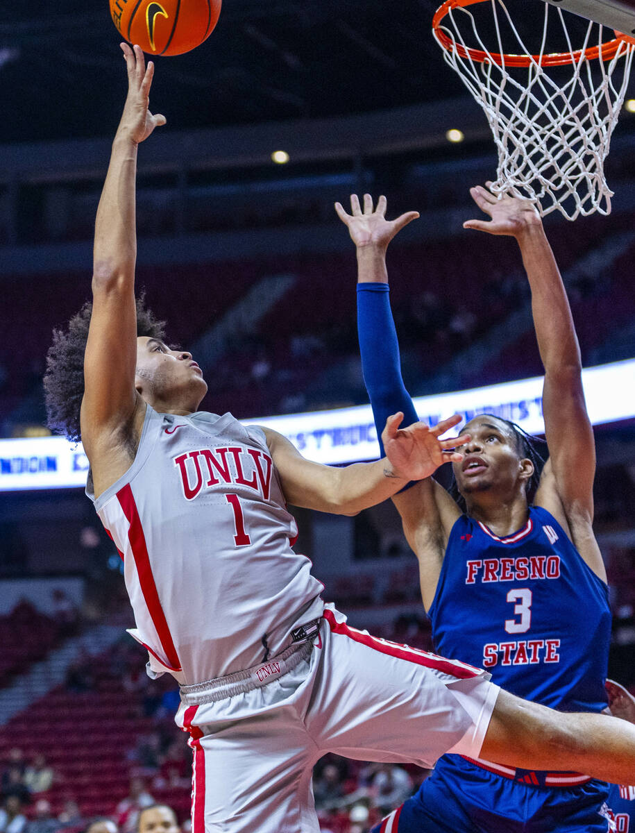 UNLV forward Jalen Hill (1) releases a shot over Fresno State Bulldogs forward Elijah Price (3) ...