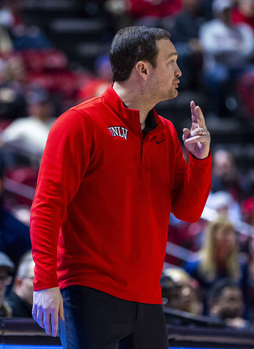 UNLV head coach Kevin Kruger signals to his players against the Fresno State Bulldogs during th ...