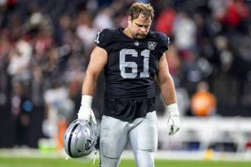 Raiders guard Jordan Meredith (61) walks off the field after losing the NFL game against the At ...