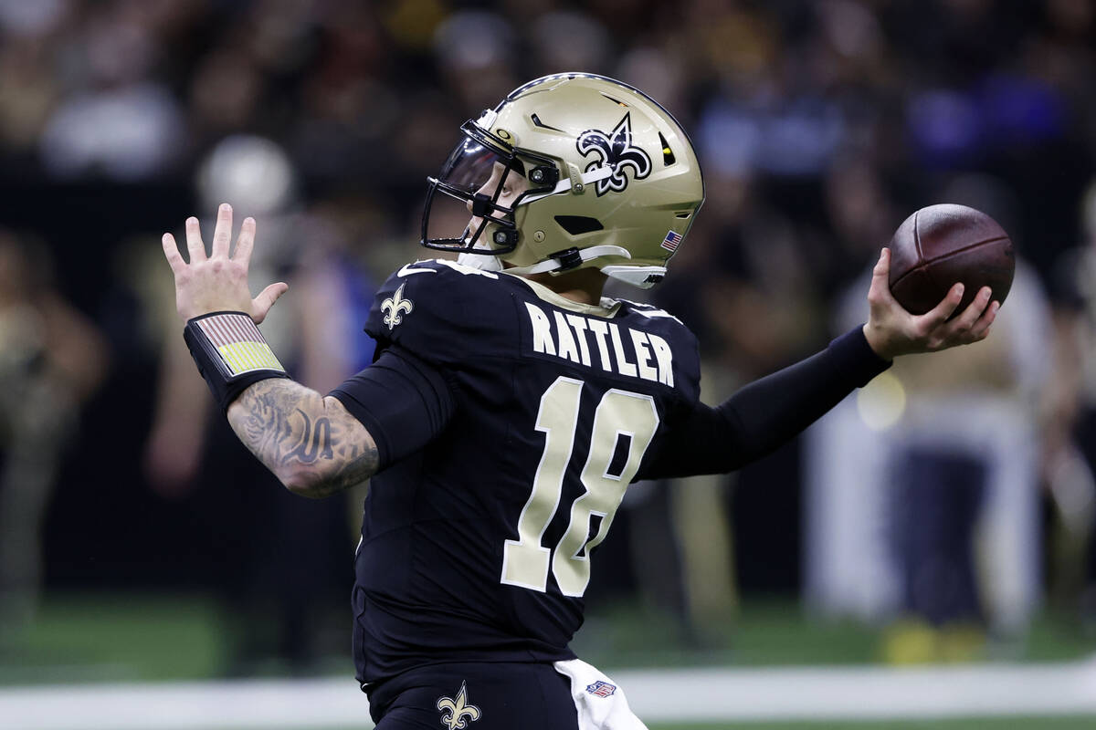 New Orleans Saints quarterback Spencer Rattler throws a pass during the first half of an NFL fo ...