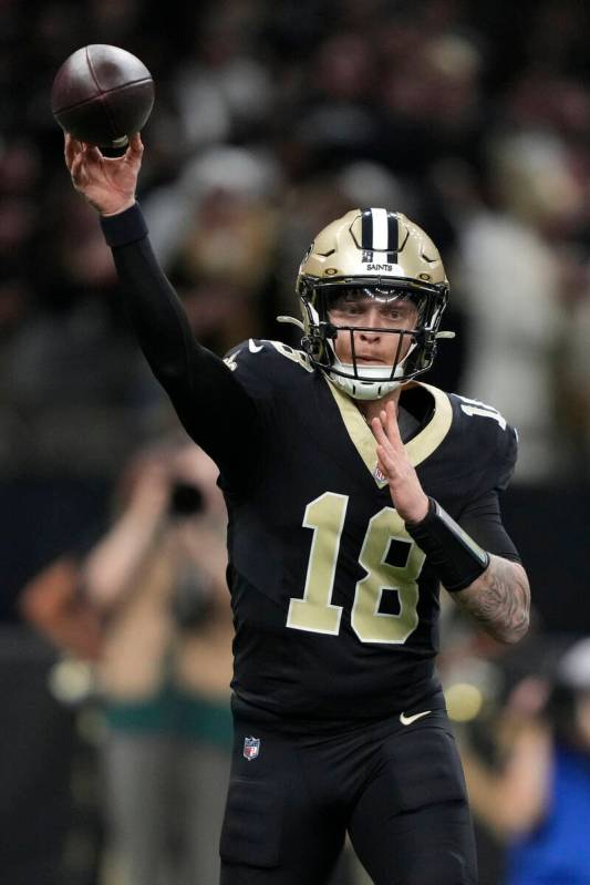 New Orleans Saints quarterback Spencer Rattler throws a pass during the first half of an NFL fo ...