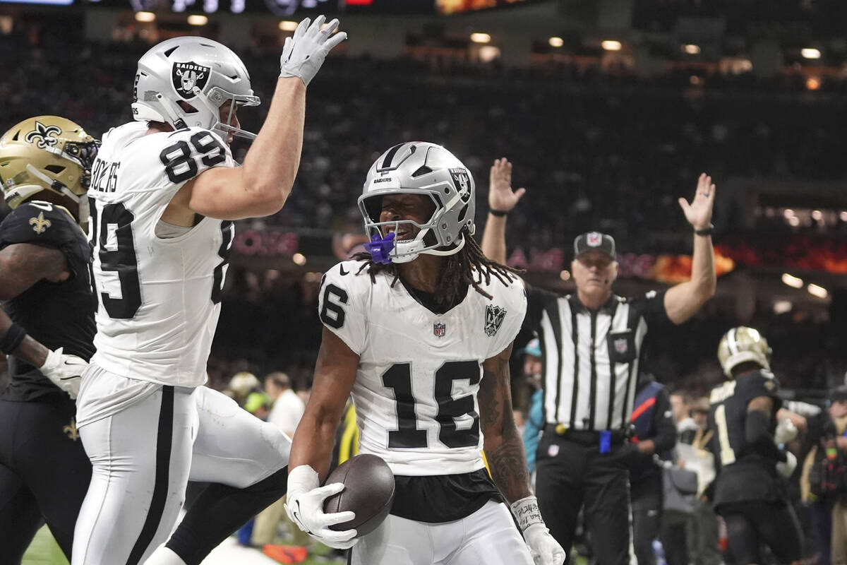 Las Vegas Raiders wide receiver Jakobi Meyers (16) celebrates with teammate tight end Brock Bow ...