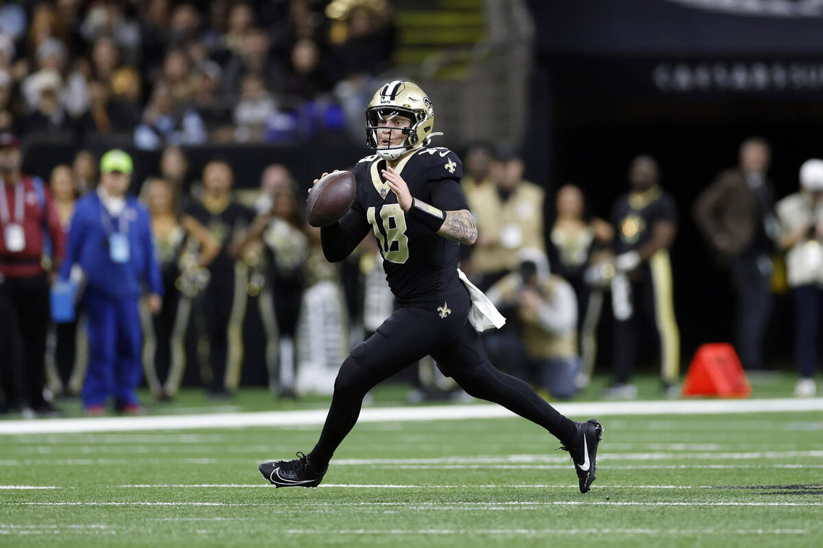 New Orleans Saints quarterback Spencer Rattler (18) looks to pass during an NFL football game a ...