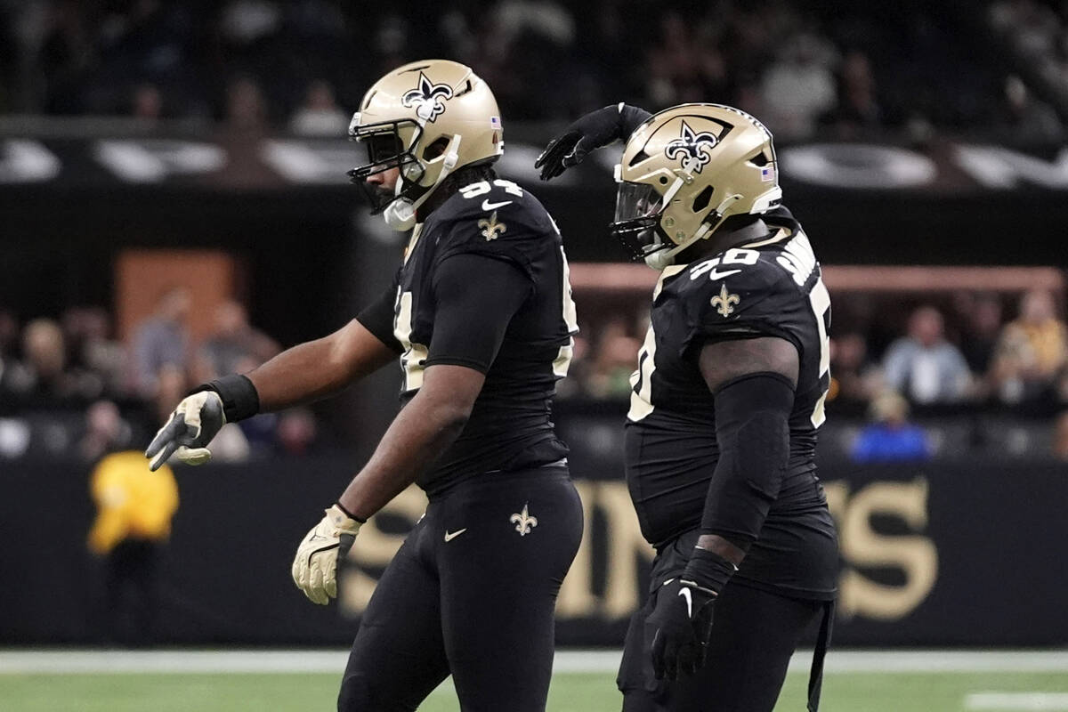 New Orleans Saints defensive end Cameron Jordan, left, reacts after a sack during the first hal ...