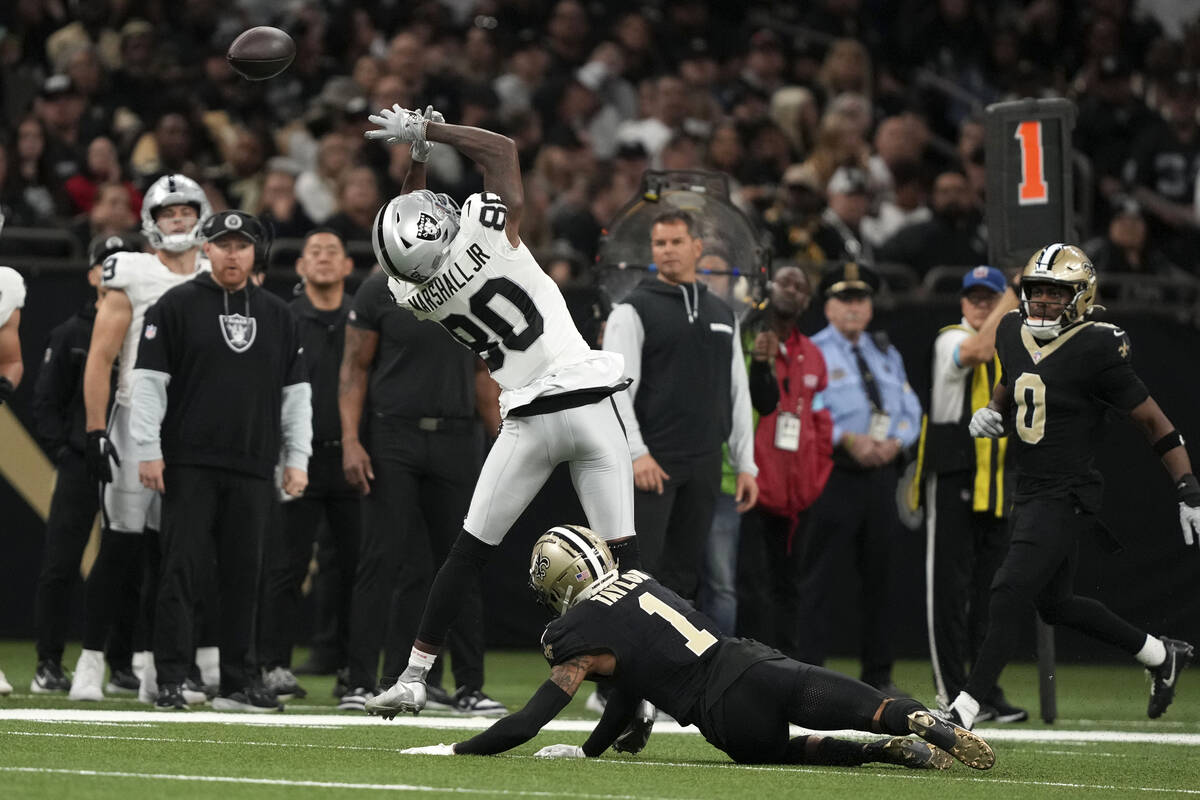 Las Vegas Raiders wide receiver Terrace Marshall Jr. (80) reaches for an incomplete pass over N ...