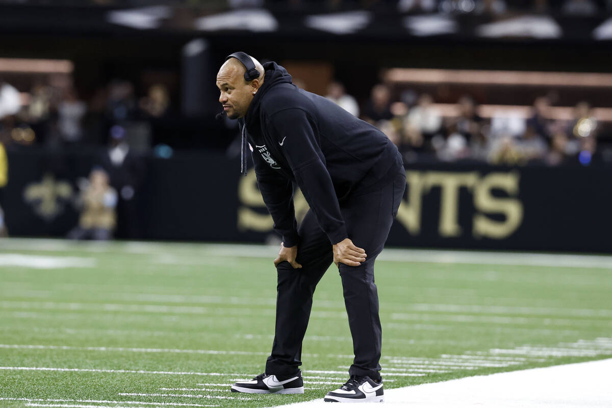 Las Vegas Raiders head coach Antonio Pierce watches from the sideline during the first half of ...