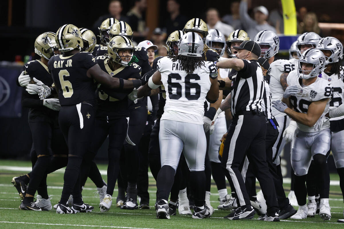 Officials separate players during the first half of an NFL football game between the New Orlean ...