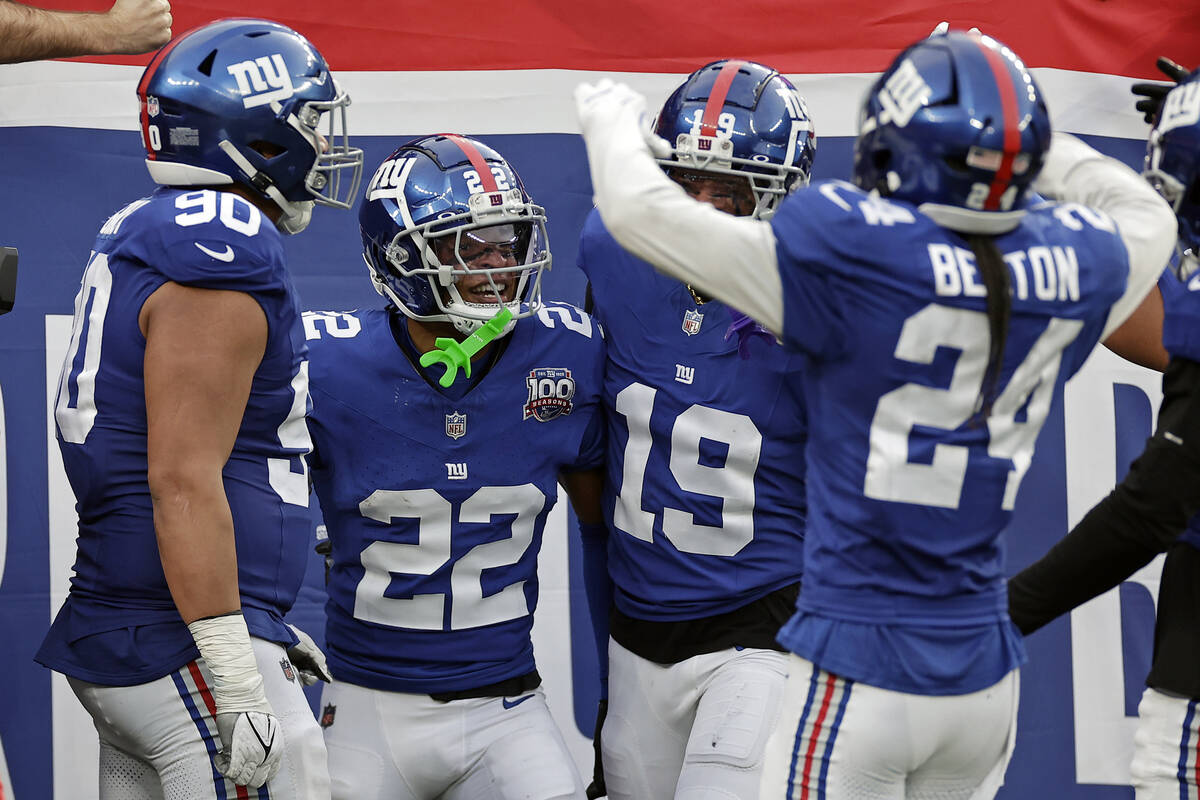 New York Giants cornerback Dru Phillips (22) reacts after an interception during an NFL footbal ...