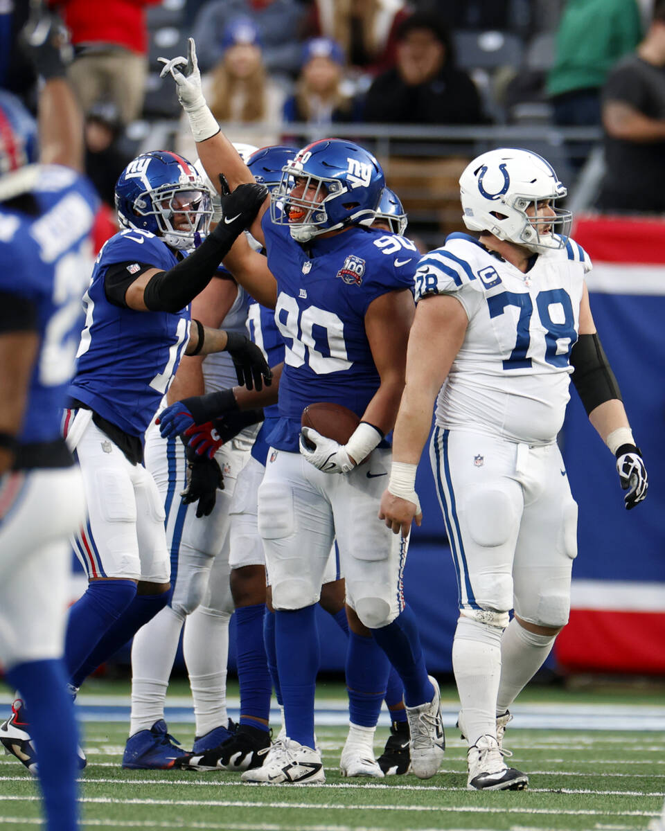 Indianapolis Colts center Ryan Kelly (78) walks away as New York Giants defensive end Elijah Ga ...