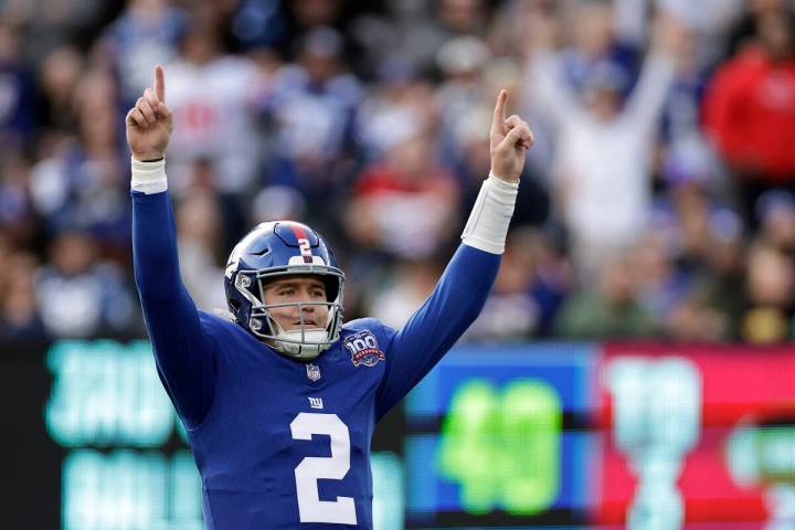 New York Giants quarterback Drew Lock (2) reacts after a touchdown pass during an NFL football ...