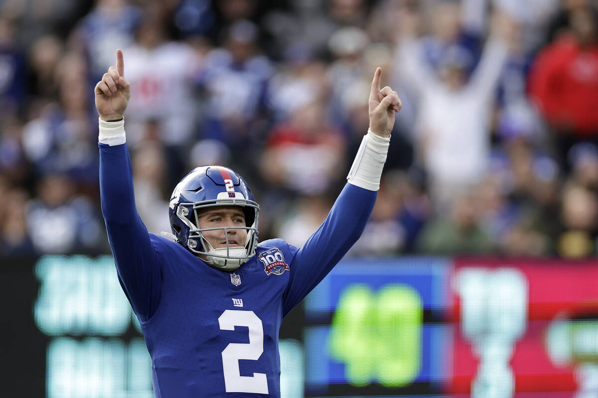 New York Giants quarterback Drew Lock (2) reacts after a touchdown pass during an NFL football ...