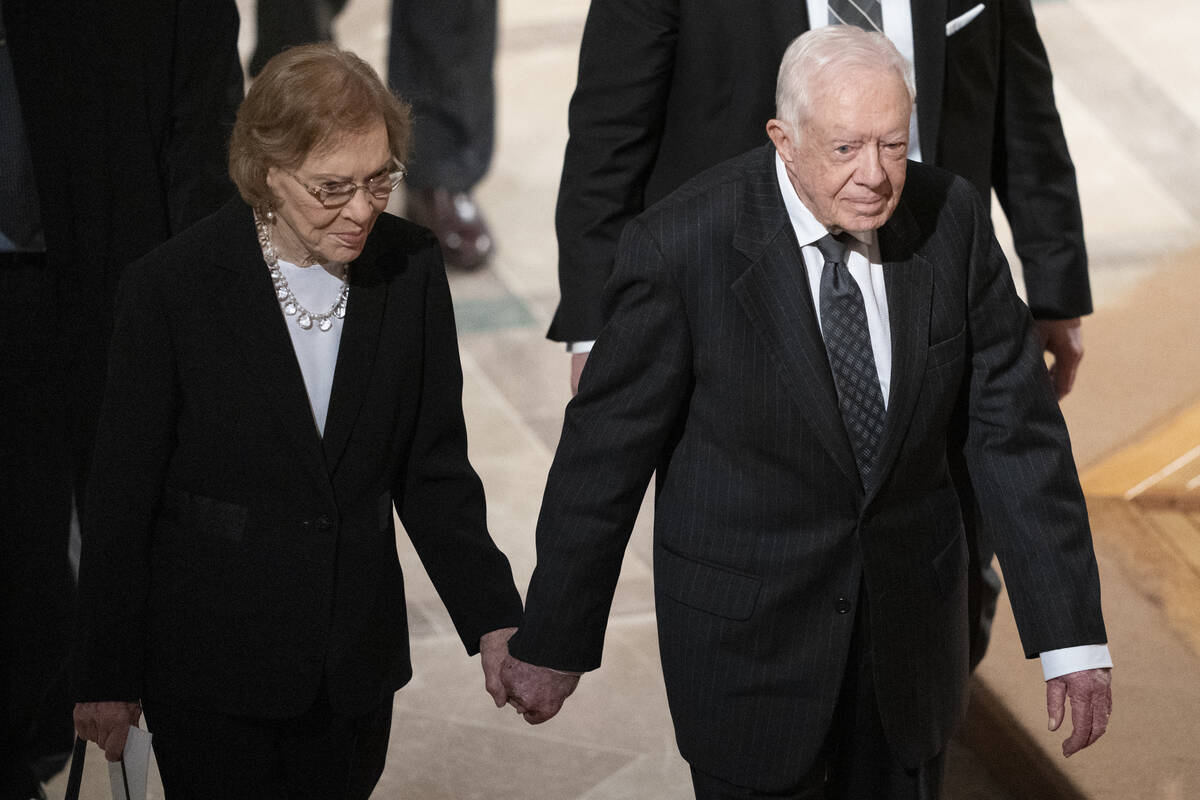 FILE - Former President Jimmy Carter, right, and his wife, former first lady Rosalynn Carter, h ...