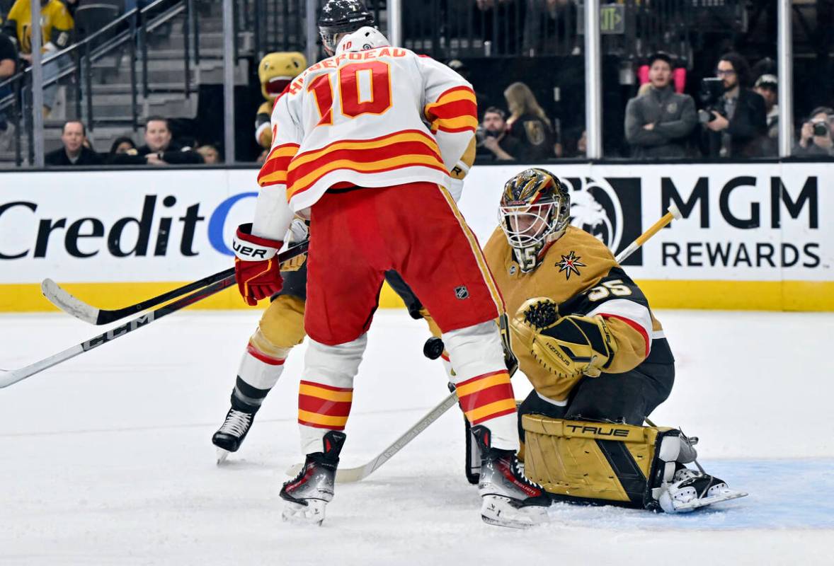 Calgary Flames center Jonathan Huberdeau (10) shoots against Vegas Golden Knights goaltender Il ...