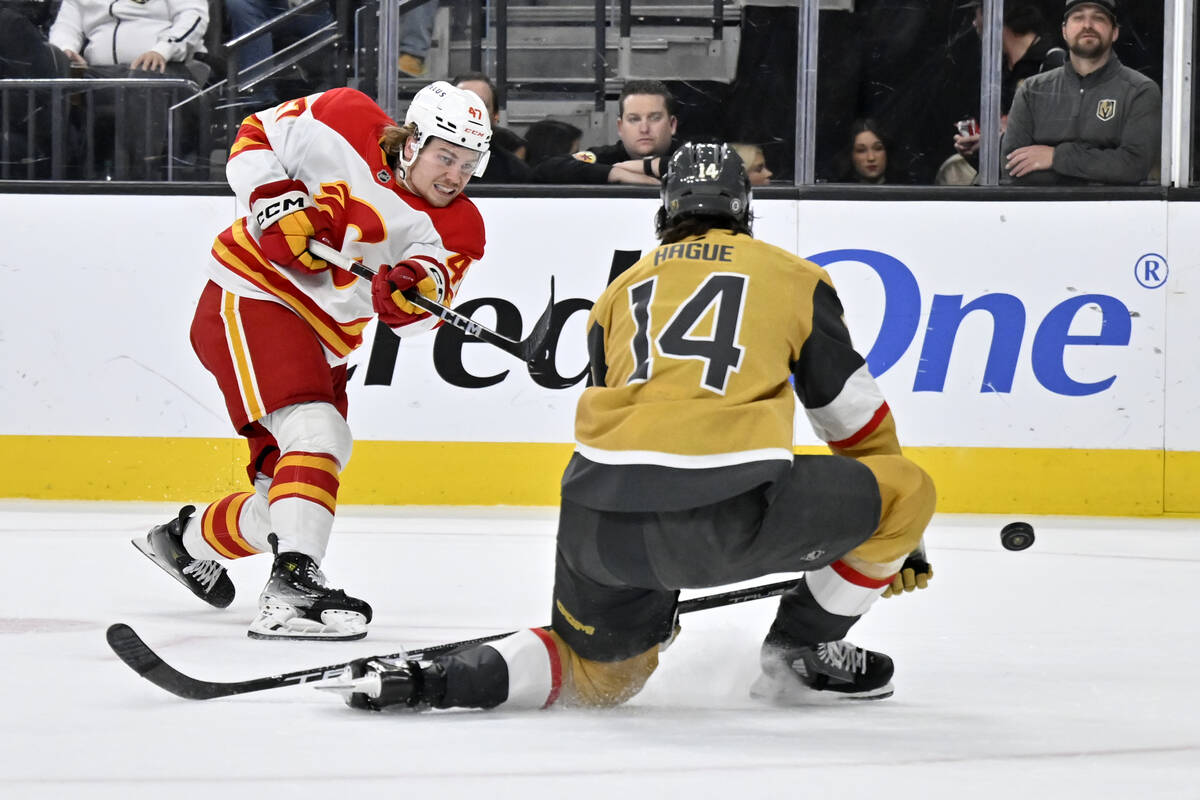 Calgary Flames center Connor Zary (47) shots against Vegas Golden Knights defenseman Nicolas Ha ...