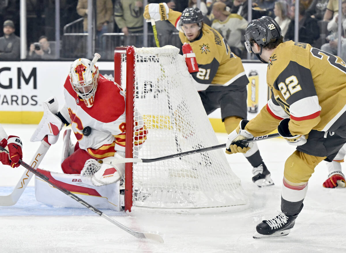 Calgary Flames goaltender Dan Vladar (80) blocks a shot by Vegas Golden Knights right wing Cole ...