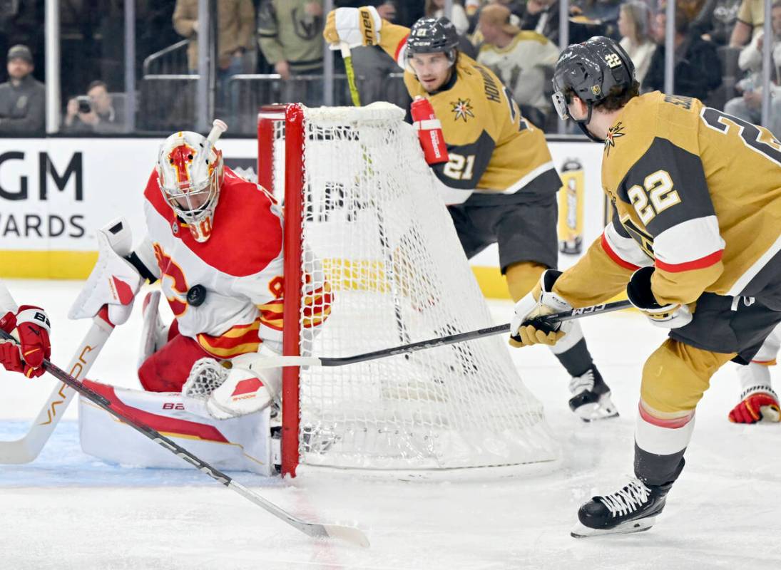 Calgary Flames goaltender Dan Vladar (80) blocks a shot by Vegas Golden Knights right wing Cole ...