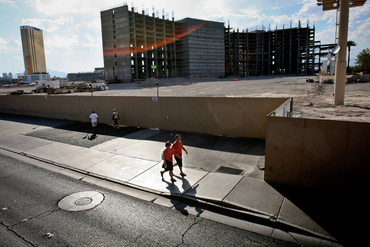 The unfinished Echelon project is seen while people walk past on the Las Vegas Strip, Tuesday, ...