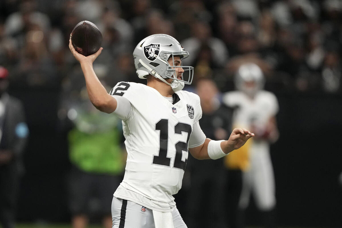 Las Vegas Raiders quarterback Aidan O'Connell throws a pass during the first half of an NFL foo ...