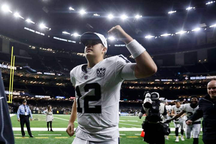 Las Vegas Raiders quarterback Aidan O'Connell (12) runs off the field after an NFL football gam ...