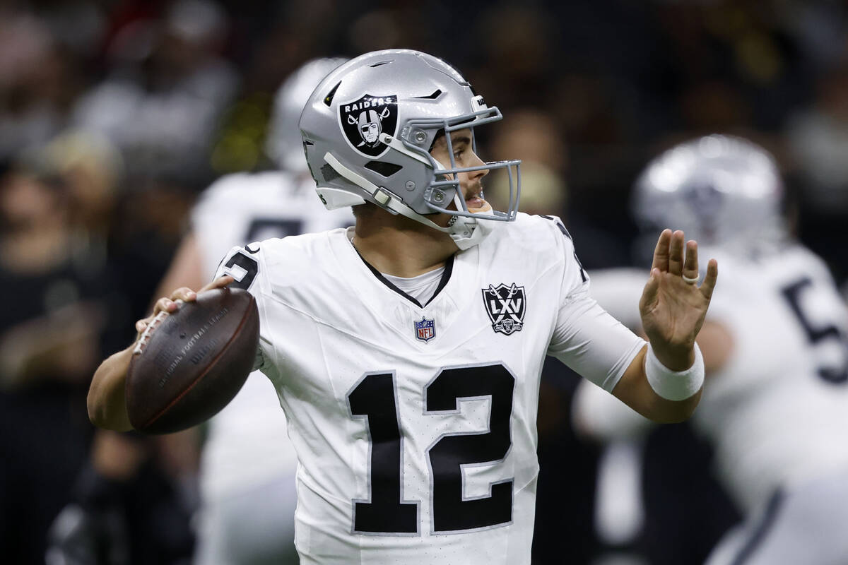 Las Vegas Raiders quarterback Aidan O'Connell throws a pass during the first half of an NFL foo ...