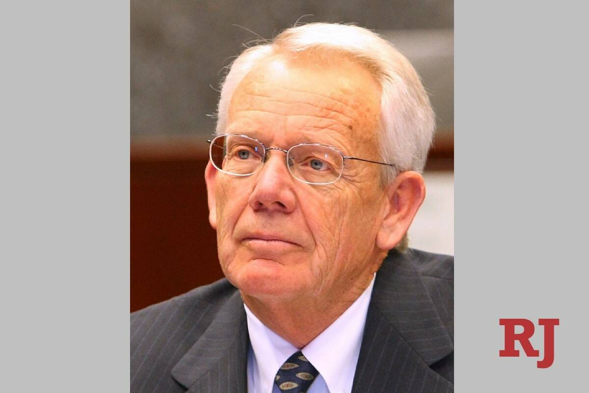 Larry Hicks listens during a news conference at the Lloyd D. George Courthouse in June 2008 in ...