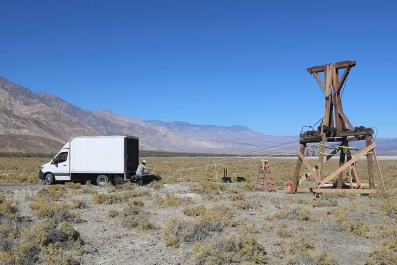 Photo 2 of 3 in series of the same tower. A National Park Service preservationist pulls the lea ...