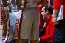 UNLV head coach Kevin Kruger instructs his players on a time out versus the Fresno State Bulldo ...