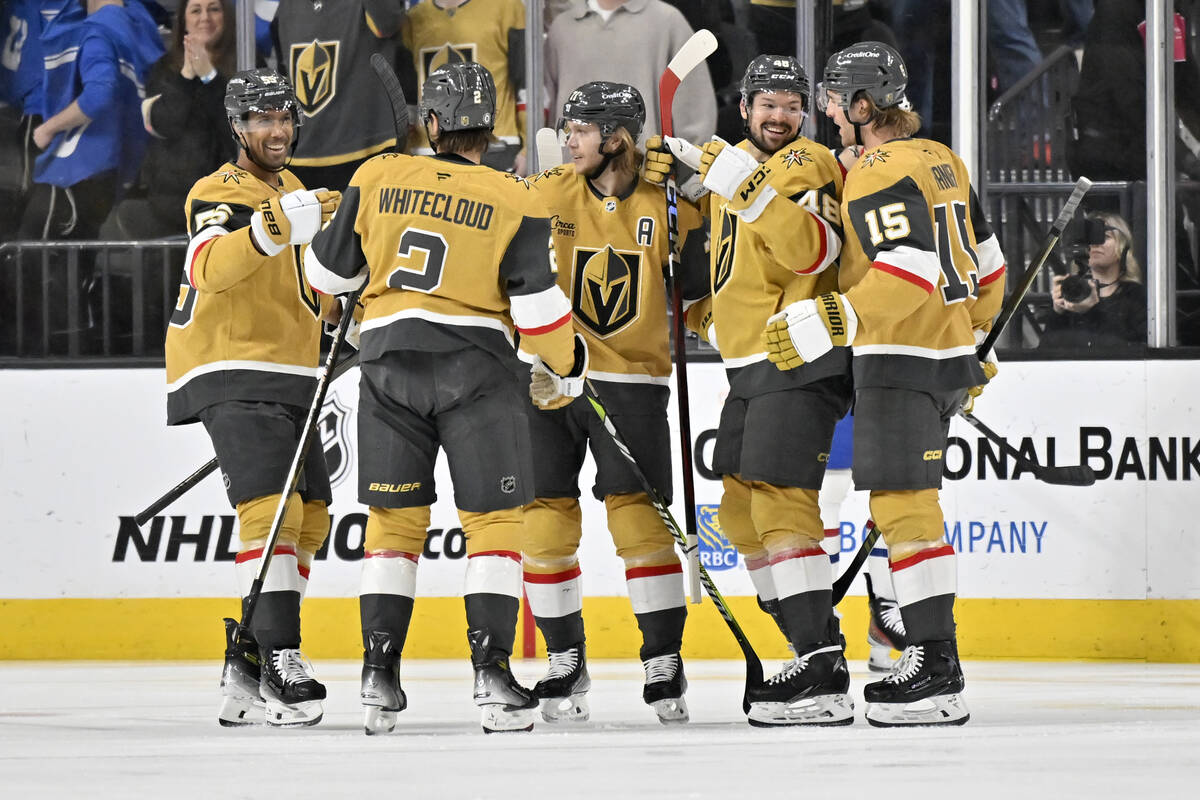 The Vegas Golden Knights celebrate defenseman Zach Whitecloud's (2) goal against the Montreal C ...