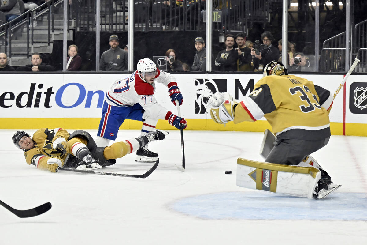 Montreal Canadiens center Kirby Dach (77) shoots and scores against Vegas Golden Knights defens ...