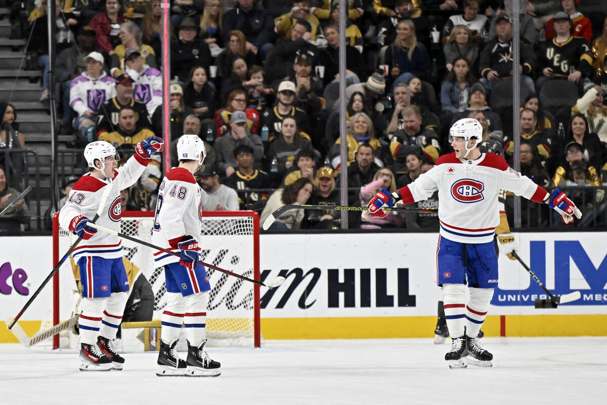 Montreal Canadiens left wing Emil Heineman (51) and Vegas Golden Knights defenseman Nicolas Hag ...