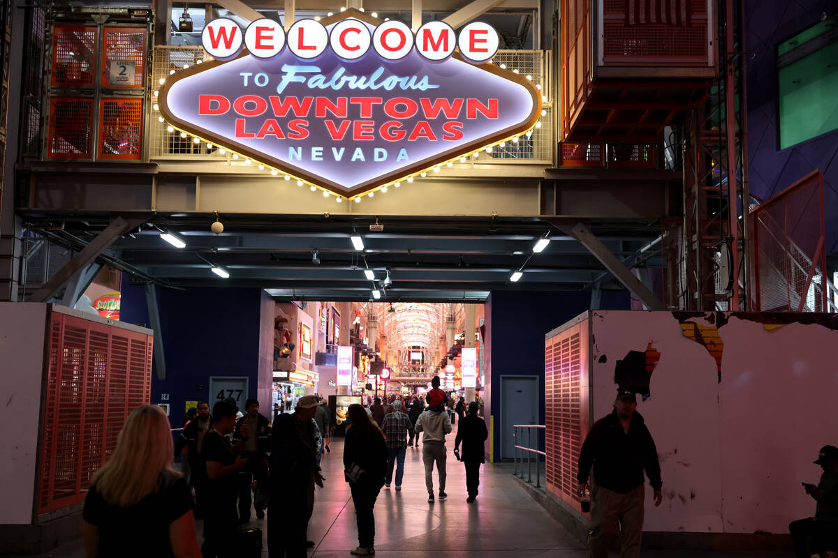 People walk through the Fremont Street Experience in downtown Las Vegas on Wednesday, Nov. 15, ...